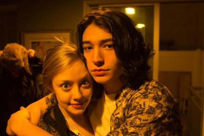 On the right side, Ezra Miller, and on the left side of the photo is Lauren Nolting hugging each other.